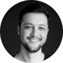 Portrait photo of George Iosif with the Gameloft Logo in the right-hand corner